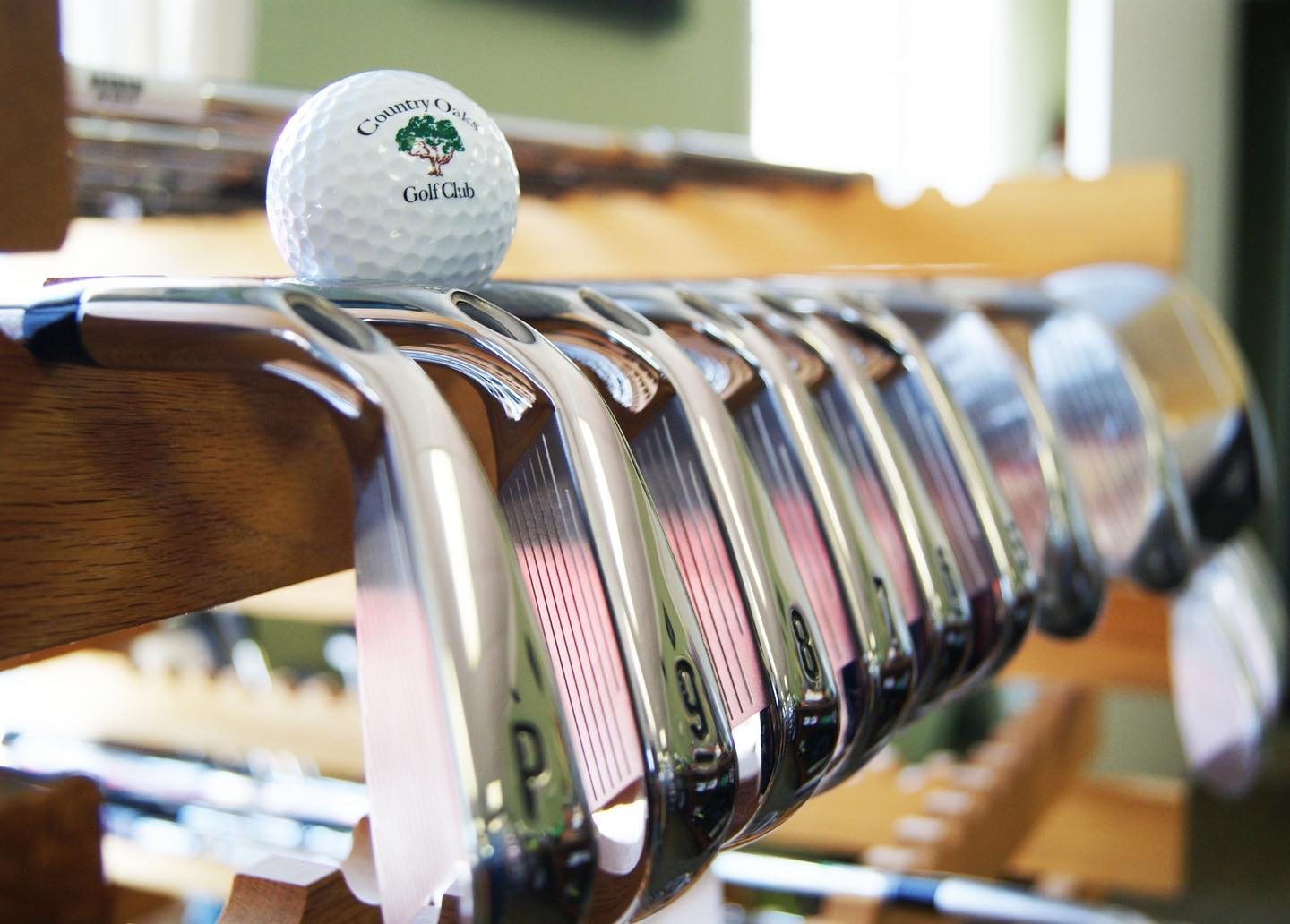 Row of golf clubs.